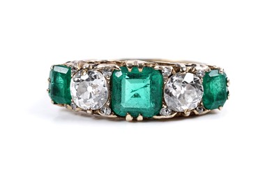 Lot 893 - A Colombian emerald and diamond ring