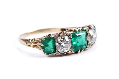 Lot 893 - A Colombian emerald and diamond ring