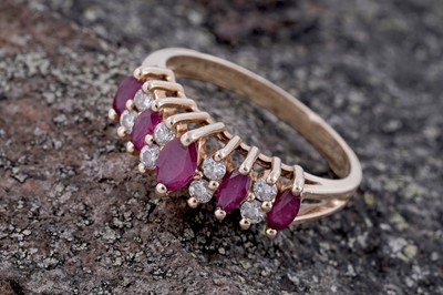 Lot 74 - A modern ruby and diamond ring