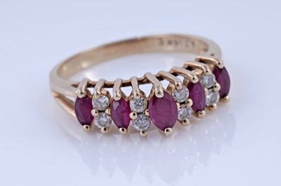 Lot 74 - A modern ruby and diamond ring
