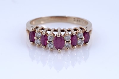 Lot 74 - A modern ruby and diamond ring