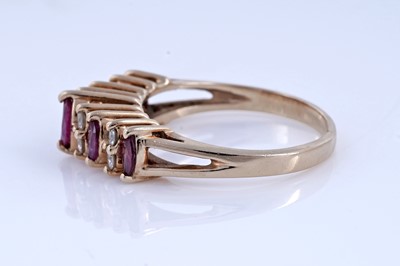 Lot 74 - A modern ruby and diamond ring