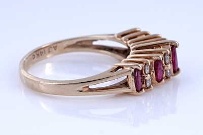 Lot 74 - A modern ruby and diamond ring