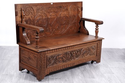 Lot 33 - A late Victorian carved oak metamorphic monk’s bench