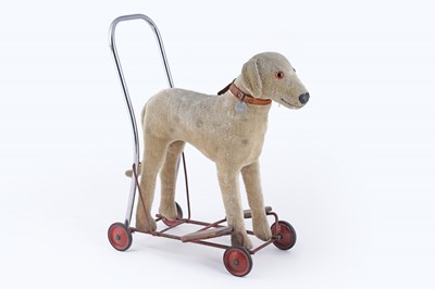 Lot 377 - A 1950’s child’s push along dog