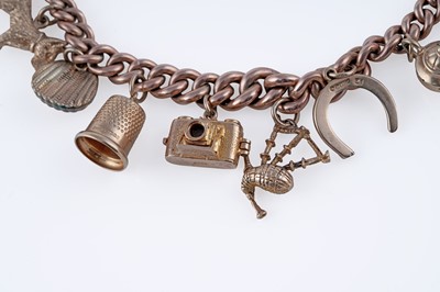Lot 38 - A 9ct rose gold charm bracelet