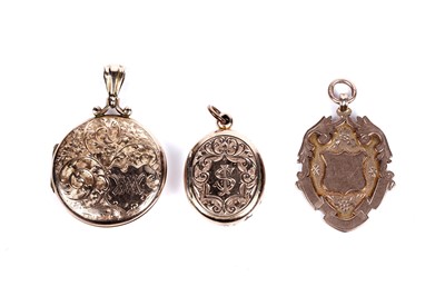 Lot 29 - Two Edwardian 9ct rose gold lockets; and a 9ct gold fob