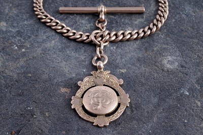 Lot 50 - A 1920's 9ct rose gold double "Albert" watch chain and fob medallion
