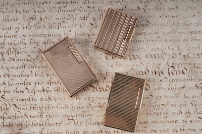 Lot 246 - Three gold plated S.T. Dupont lighters