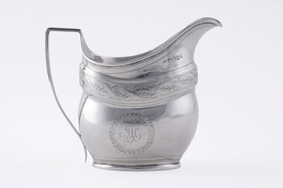 Lot 65 - A George III silver cream jug