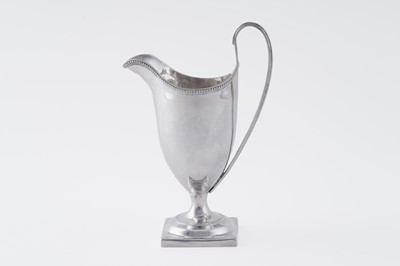 Lot 67 - A George III silver helmet cream jug