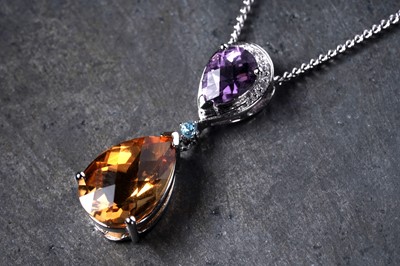 Lot 273 - A modern citrine, diamond and amethyst pendant