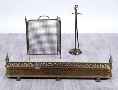 Lot 229 - A late 19th Century brass fire fender; and fire accessories