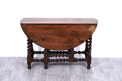 Lot 83 - A late 17th/18th Century and later oak gateleg dropleaf table
