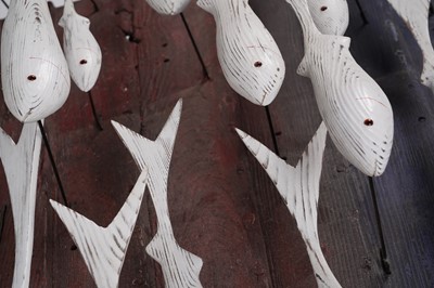Lot 651 - Max Tannahill - Fishes | sculpture: a wooden shoal of fish and the remnants of a boat hull