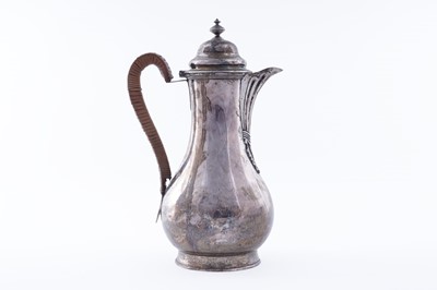 Lot 419 - A George III silver hot water jug of baluster form