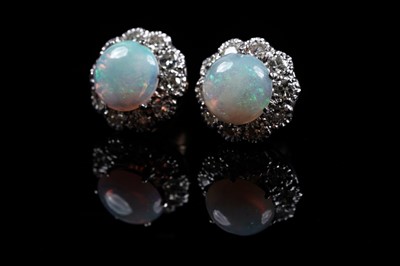 Lot 903 - A pair of opal and diamond cluster earrings