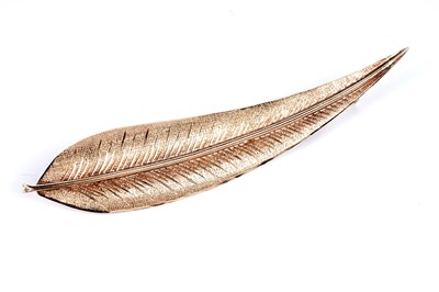 Lot 41 - A "Swiss blue" topaz bar brooch, and a gold leaf-pattern brooch