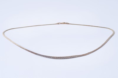 Lot 146 - A contemporary 9ct yellow gold graded curb-link necklace