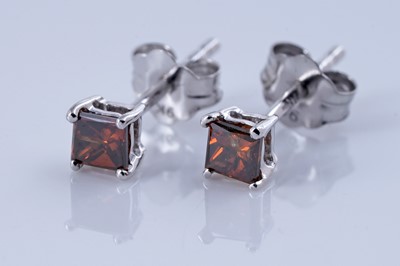 Lot 151 - A pair of red diamond stud earrings
