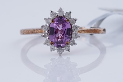 Lot 153 - A contemporary Madagascan purple sapphire and diamond ring