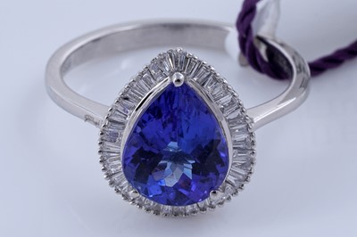 Lot 160 - A contemporary tanzanite and diamond ring on platinum