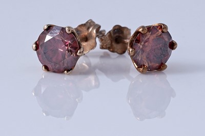 Lot 163 - A contemporary pair of red Moissanite stud earrings
