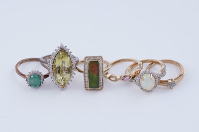 Lot 169 - Contemporary gemstone rings on silver gilt, including sapphire, emerald, and opal