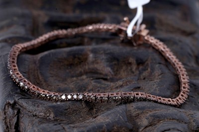 Lot 171 - A contemporary champagne diamond line bracelet