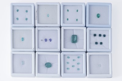 Lot 175 - A collection of loose and variously fashioned green and blue gemstones