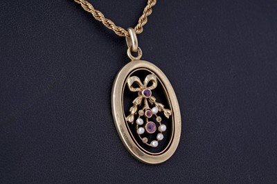 Lot 4 - An Edwardian pink topaz and seed pearl openwork pendant