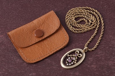 Lot 131 - An Edwardian pink topaz and seed pearl openwork pendant