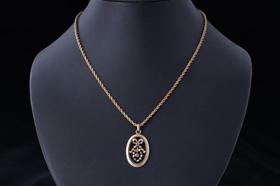 Lot 4 - An Edwardian pink topaz and seed pearl openwork pendant
