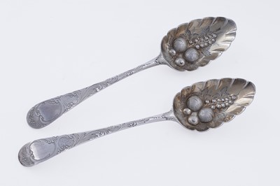 Lot 387 - A pair of George III silver berry spoons