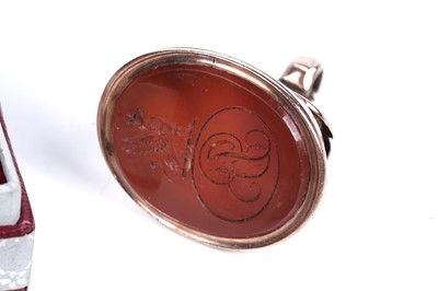 Lot 30 - A 19th Century rose gold and carnelian fob seal with intaglio armorial crest; and further seals