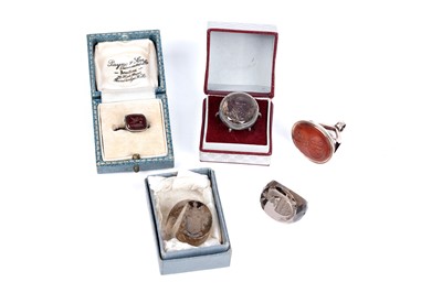 Lot 30 - A 19th Century rose gold and carnelian fob seal with intaglio armorial crest; and further seals