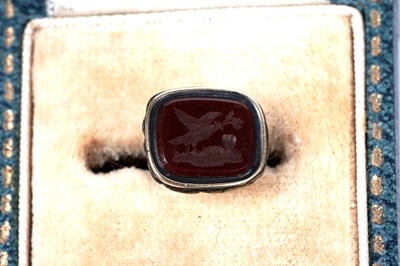 Lot 30 - A 19th Century rose gold and carnelian fob seal with intaglio armorial crest; and further seals