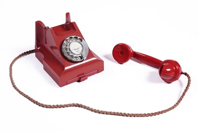 Lot 597 - A GPO model 332 red Bakelite telephone