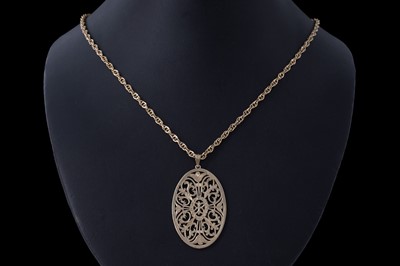Lot 34 - A decoratively pierced 14ct gold pendant plaque on chain