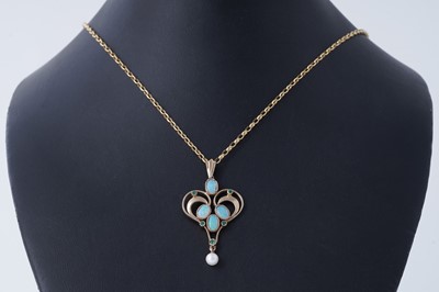 Lot 12 - An Edwardian Art Nouveau style opal, emerald, and pearl pendant necklace