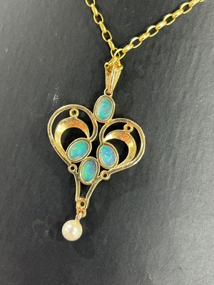 Lot 12 - An Edwardian Art Nouveau style opal, emerald, and pearl pendant necklace