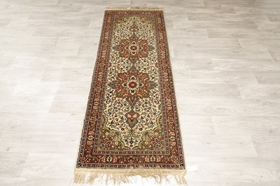 Lot 104 - A Tabriz runner