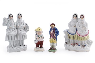 Lot 194 - A collection of pottery figures