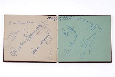 Lot 441 - An autograph book containing a collection of footballing signatures