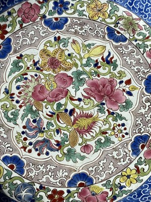 Lot 810 - A Chinese blue and white saucer dish; and a Canton enamel dish