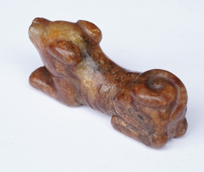Lot 826 - A small rust coloured jade dog