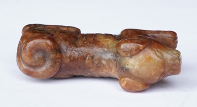 Lot 826 - A small rust coloured jade dog
