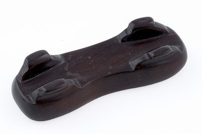 Lot 826 - A small rust coloured jade dog