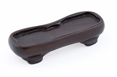 Lot 826 - A small rust coloured jade dog