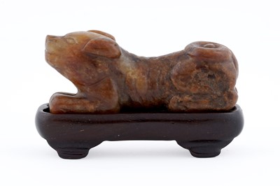 Lot 826 - A small rust coloured jade dog